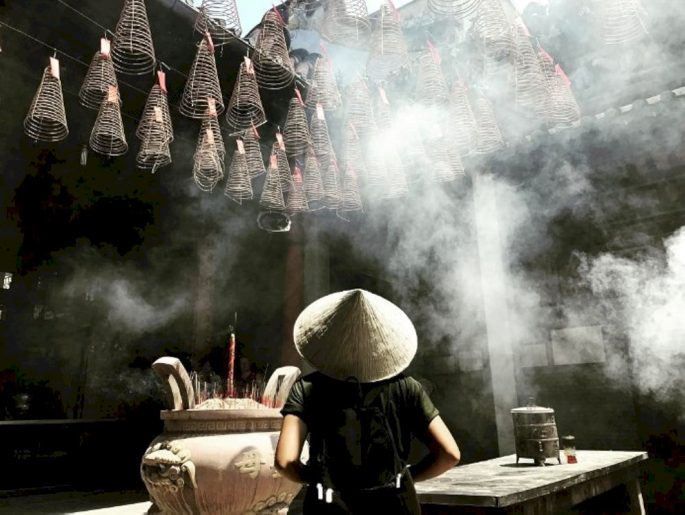 Artistic angles capture incense smoke and filtered light 